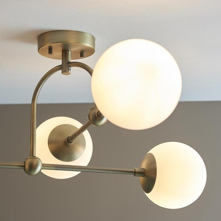 Thorlight Merlin Matt Antique Brass Finish 4 Light Semi Flush Ceiling Light Complete With Opal Glass Globes