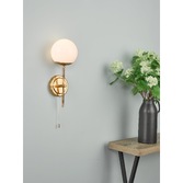 Photograph: Dar Bombazine Single Wall Light In Natural Brass Complete With Opal Glass