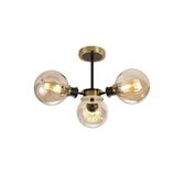 Photograph: Idolite Haughton IP Semi Ceiling, 3 x E14 With 15cm Round Segment Glass Shade, Brass, Amber Plated & Satin Black