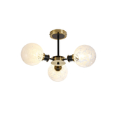 Photograph: Idolite Haughton IP Semi Ceiling, 3 x E14 With 15cm Round Speckled Glass Shade, Brass, White & Satin Black