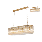 Photograph: Idolite Nuboda 100 x 35cm 14 Light Linear Oval Pendant Brass With Clear Glass Rods