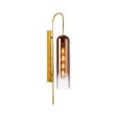 Photograph: Idolite Var Gold Long Linear Wall Light Complete With A Copper Fade Cylindrical Ribbed Glass