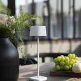 Photograph: Konstsmide Capri Mini Usb Outdoor Portable Desk Lamp In White - IP54 - 2200K/3000K