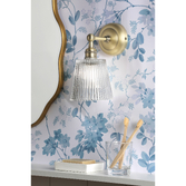 Photograph: Laura Ashley Callaghan Bathroom Wall Light Matt Antique Brass and Ribbed Glass IP44