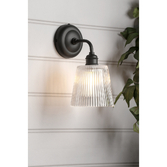 Photograph: Laura Ashley Callaghan Matt Black Outdoor Wall Light Complete With Clear Ribbed Glass - IP44