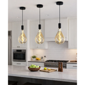 Photograph: Milan Single Pendant Matt Black With Large Amber Spiral Filament Bulb