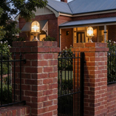 Photograph: Navigator Wellington Raw Brass Grand Post Lantern Complete With Clear Ribbed Glass - IP54, Solid Brass, Coastal