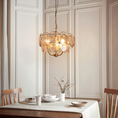 Photograph: Thorlight Buxton Brushed Aged Brass 3 Light Pendant Light Complete With Handmade Champagne Glass Discs