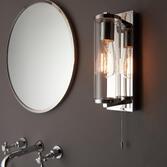 Photograph: Thorlight Kairo Single Bathroom Wall Light In Polished Chrome With A Clear Cylindrical Glass Shade - IP44