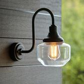 Photograph: Thorlight Kukes Matt Black Exterior Swan Neck Wall Light With Clear Glass Shade