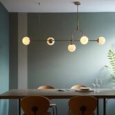 Photograph: Thorlight Merlin Matt Antique Brass Finish 5 Light Linear Bar Pendant Complete With Opal Glass Globes