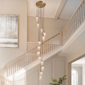 Photograph: Thorlight Trentham Large 13 Light Antique Brass Stairway Cascade Light Complete With Clear Glass Shades