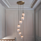 Photograph: Thorlight Trentham Large 7 Light Antique Brass Stairway Cascade Light Complete With Clear Ribbed Glass Shades