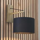 Photograph: Thorlight Yareli Matt Brass Finish Wall Light Complete With Black Cotton Shade