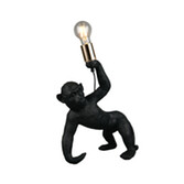 Photograph: Trio Lighting Bobo Black Resin Monkey Table Lamp