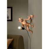 Photograph: Trio Lighting Louy Gold Resin Monkey Plug-In Wall Light