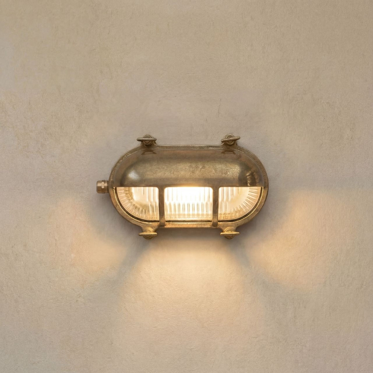 Navigator Palaemon Raw Brass Eyelid Oval Bulkhead - IP64, Solid Brass, Coastal