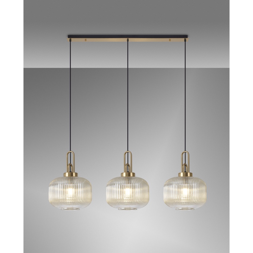 Photograph: Idolite Camille Brass Gold 3 Light Linear Bar Pendant With Champagne Ribbed Glasses