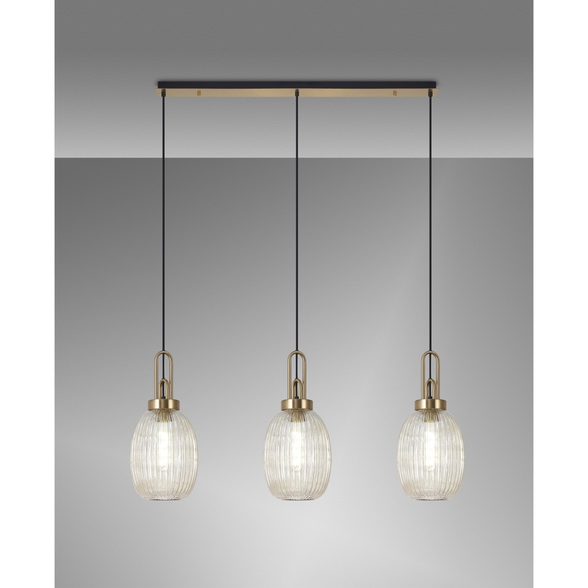 Photograph: Idolite Camille Brass Gold 3 Light Linear Bar Pendant With Champagne Ribbed Glasses