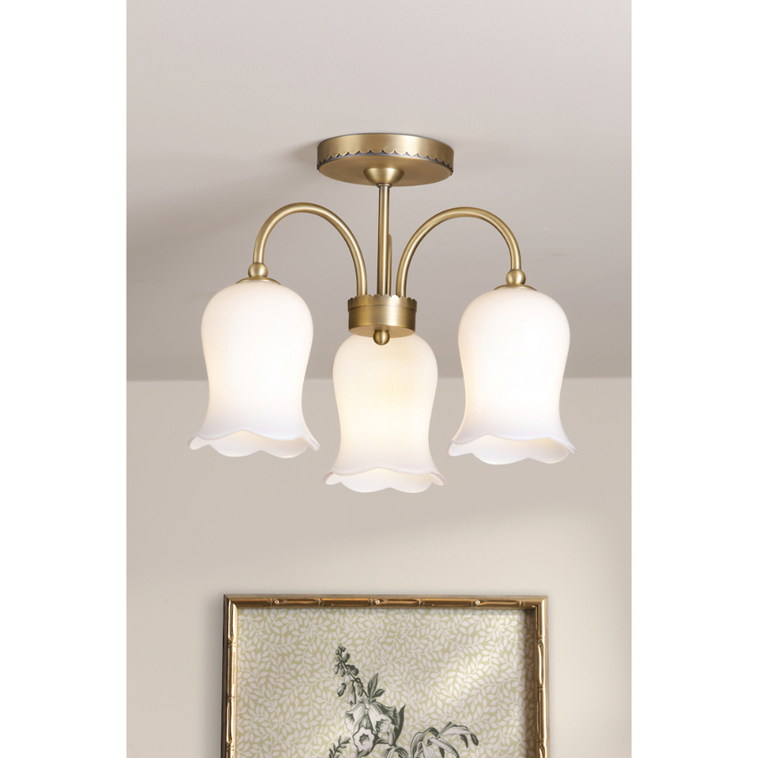 Photograph: Laura Ashley Lidsell Matt Antique Brass 3 Light Semi-Flush Downward Facing Ceiling Light Complete With Scalloped Opal Glass Shades