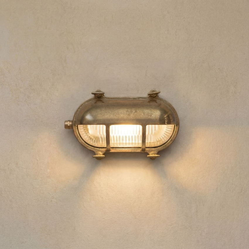 Photograph: Navigator Palaemon Raw Brass Eyelid Oval Bulkhead - IP64, Solid Brass, Coastal