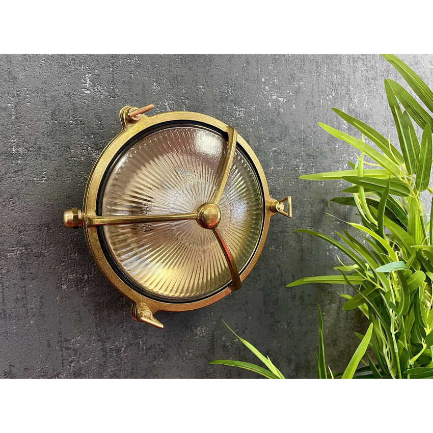 Photograph: Navigator Trident Raw Brass Circular Bulkhead - IP64, Solid Brass, Coastal