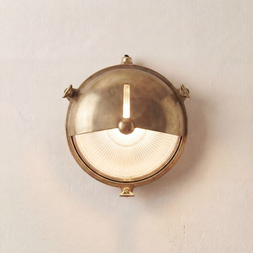 Photograph: Navigator Trident Shield Raw Brass Circular Bulkhead - IP64, Solid Brass, Coastal