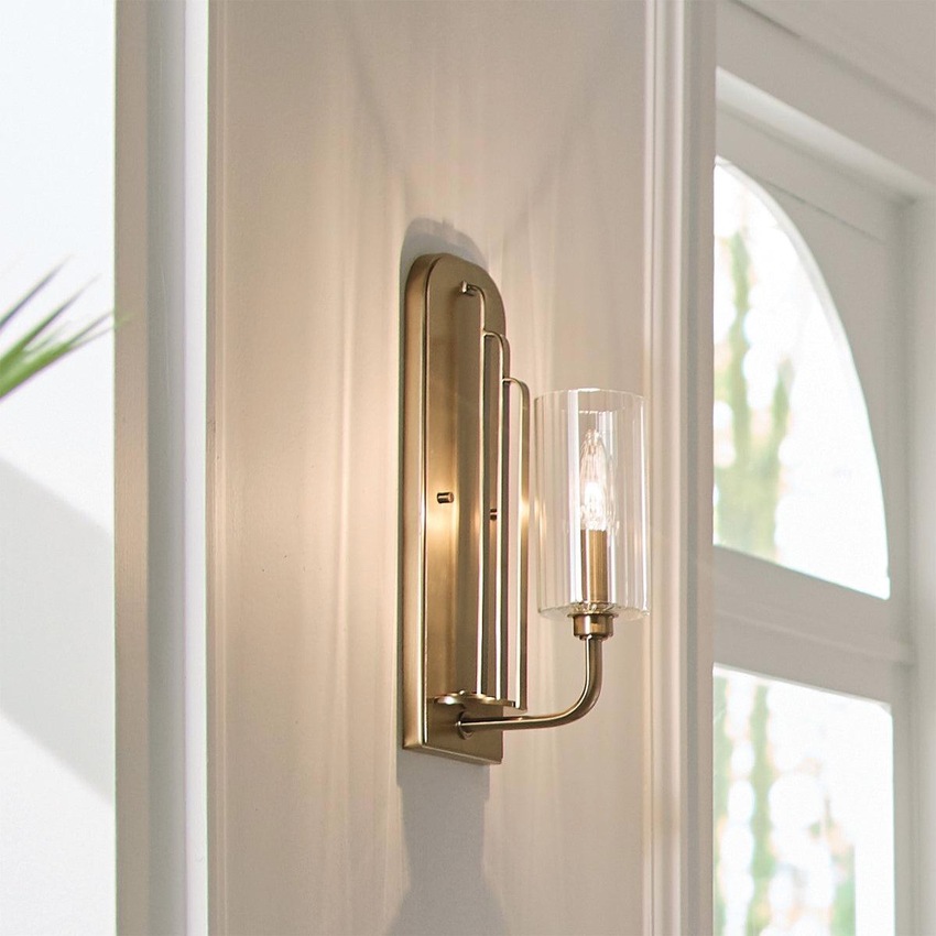 Photograph: Quintiesse Kimrose 1 Light Wall Light In Brushed Natural Brass Complete With Gently RIbbed Clear Glass Shade - QN-KIMROSE1-BNB