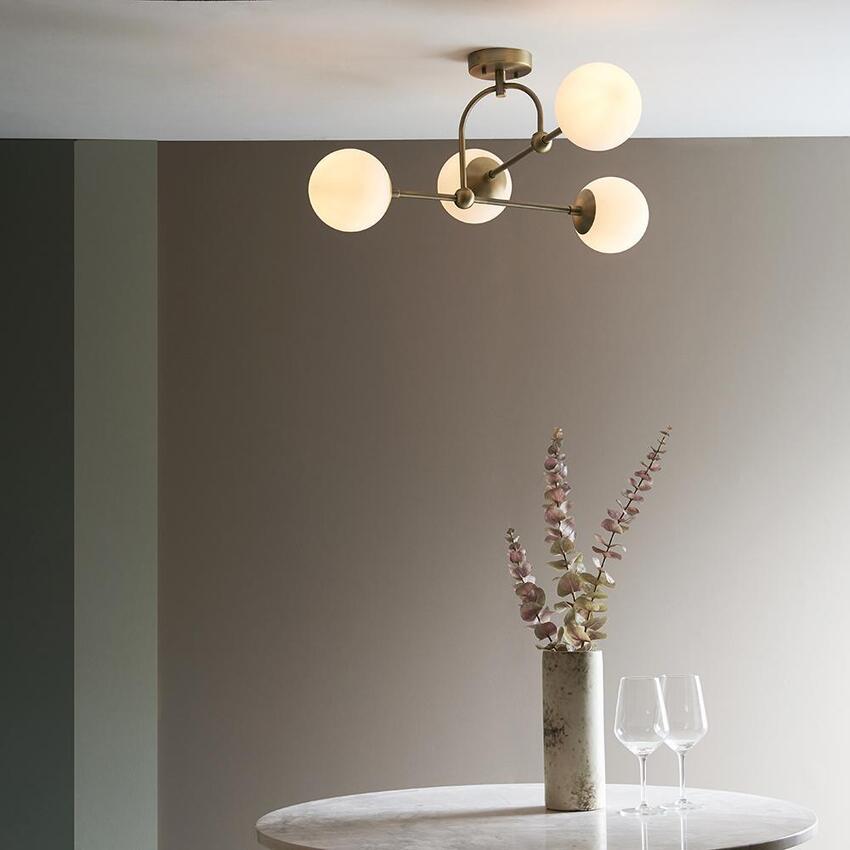 Photograph: Thorlight Merlin Matt Antique Brass Finish 4 Light Semi Flush Ceiling Light Complete With Opal Glass Globes