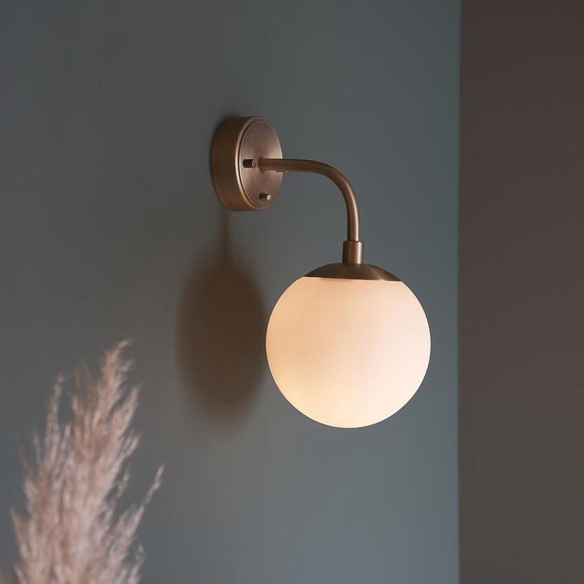 Photograph: Thorlight Merlin Matt Antique Brass Finish Single Wall Light Complete With Opal Glass Globe