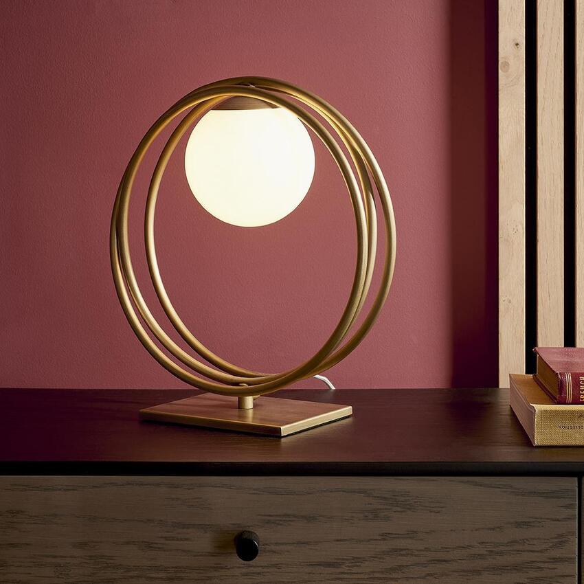 Photograph: Thorlight Ravi Brushed Gold Finish Table Lamp Complete With Glossy Opal Glass Globe