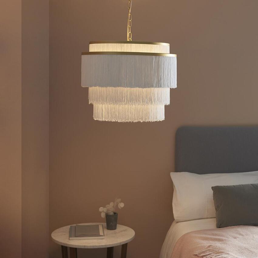 Photograph: Thorlight Rey Matt Gold Finish 3 Light Pendant Complete With White Soft Tassels