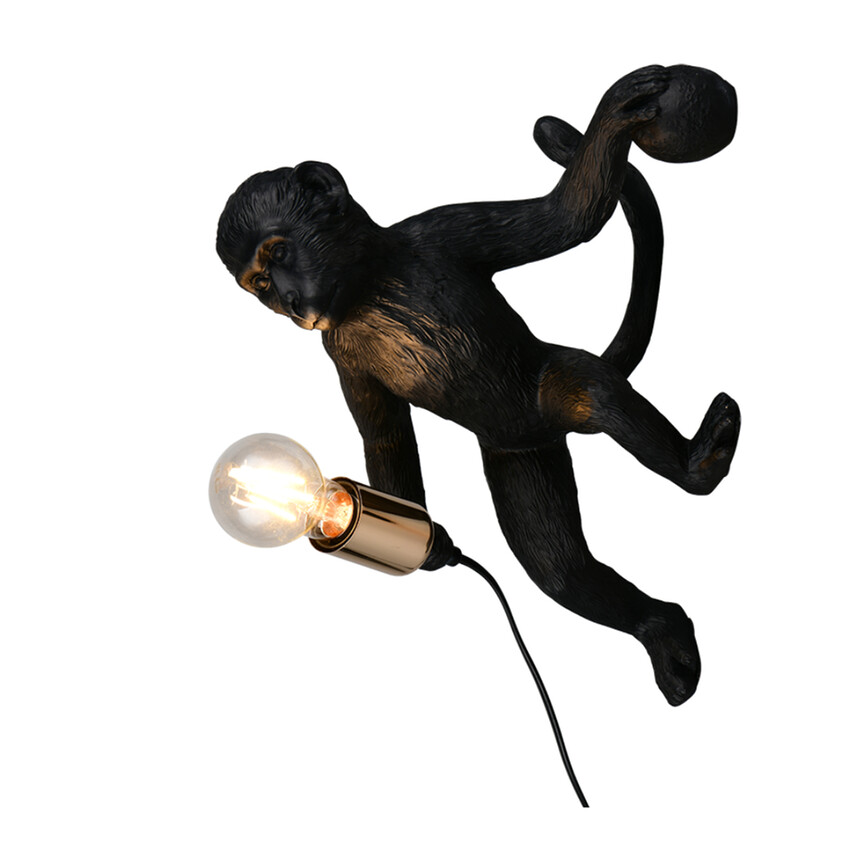 Photograph: Trio Lighting Louy Black Resin Monkey Plug-In Wall Light